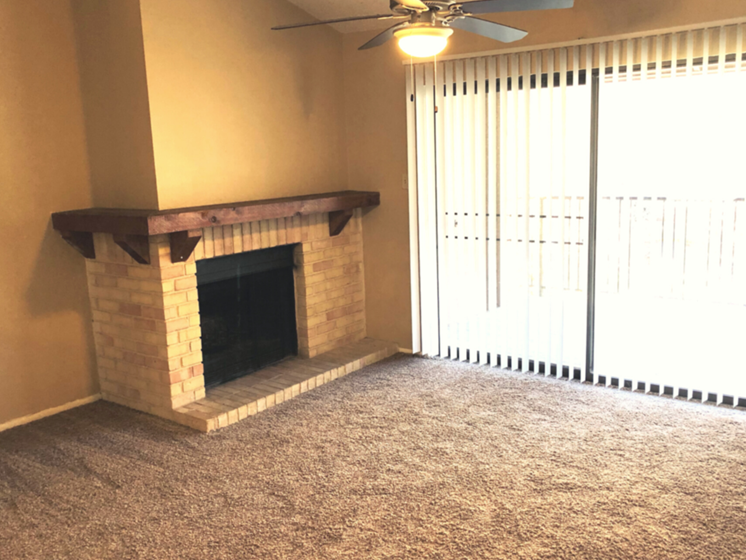 Fireplace in living room near large balcony